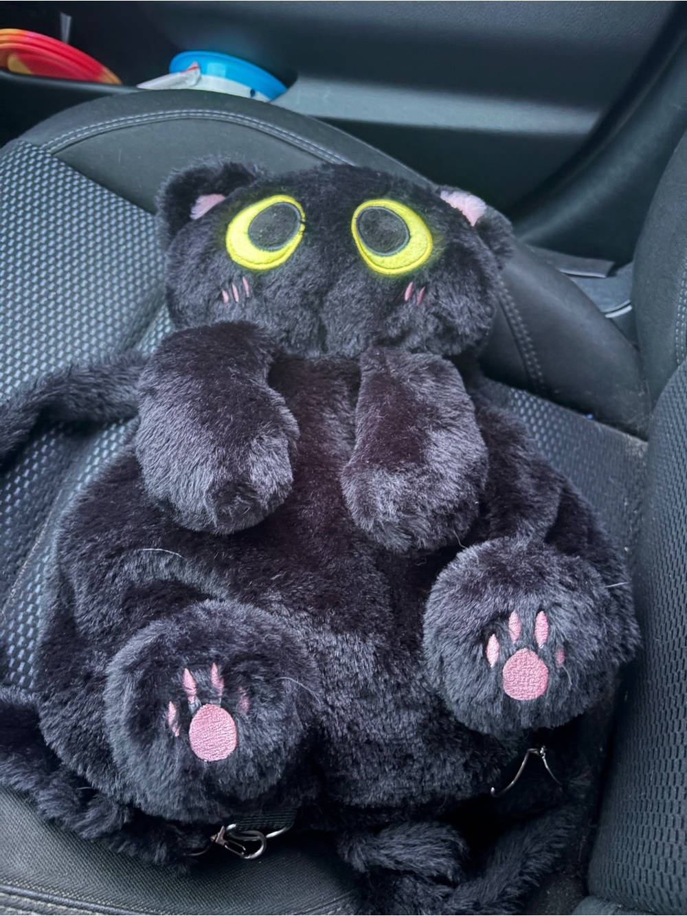 Black Plush Cat Backpack with Yellow Eyes and Pink Paw Accents